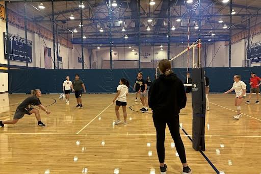 Students playing Intramural Volleyball